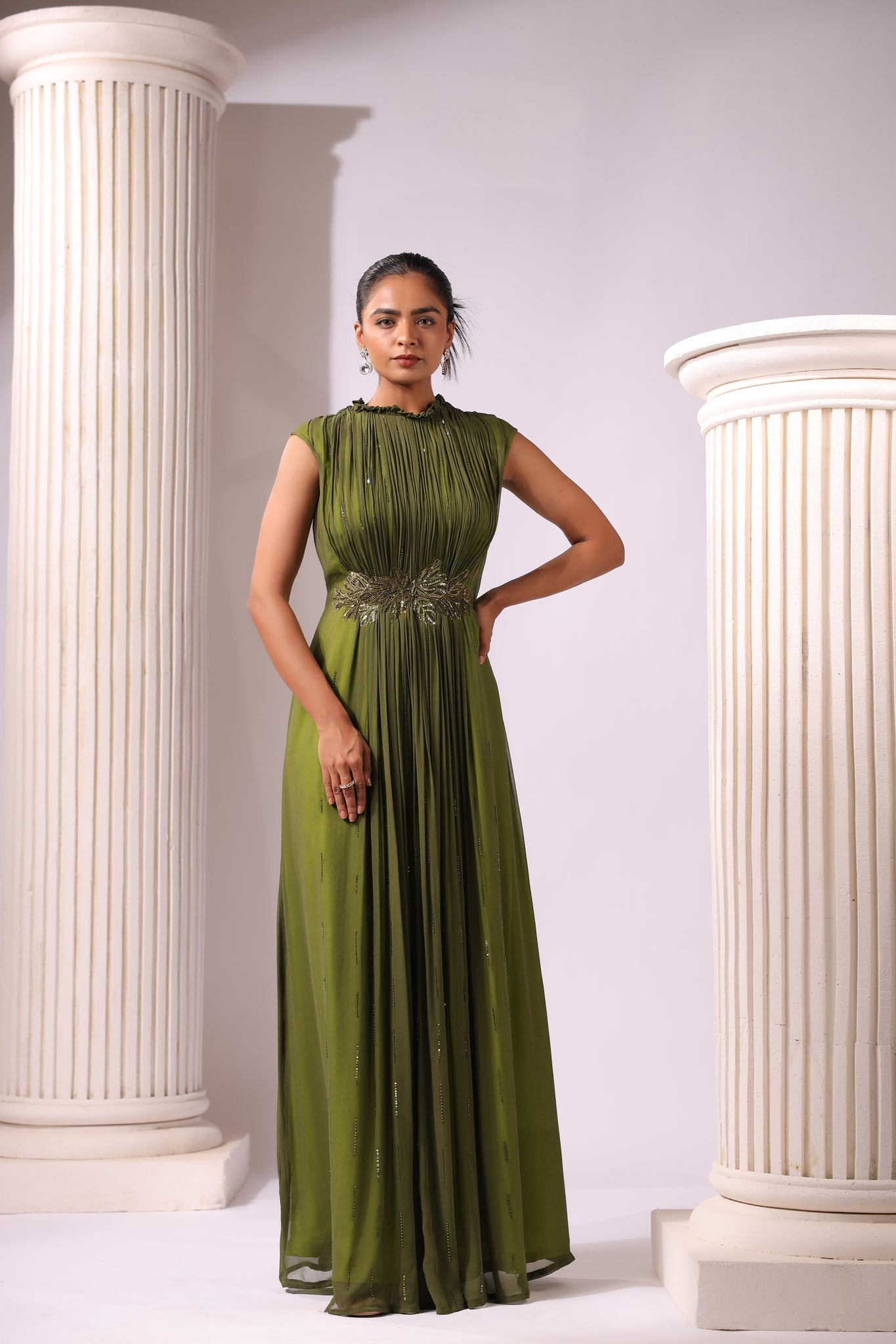 OLIVE GREEN GEORGETTE GOWN WITH APPLIQUE FLOWERS AT THE WAIST